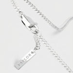 Silver chain necklace with a pendant on a white background