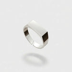 Silver ring on a light gray background