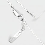 Silver bracelet with a tag on a white background