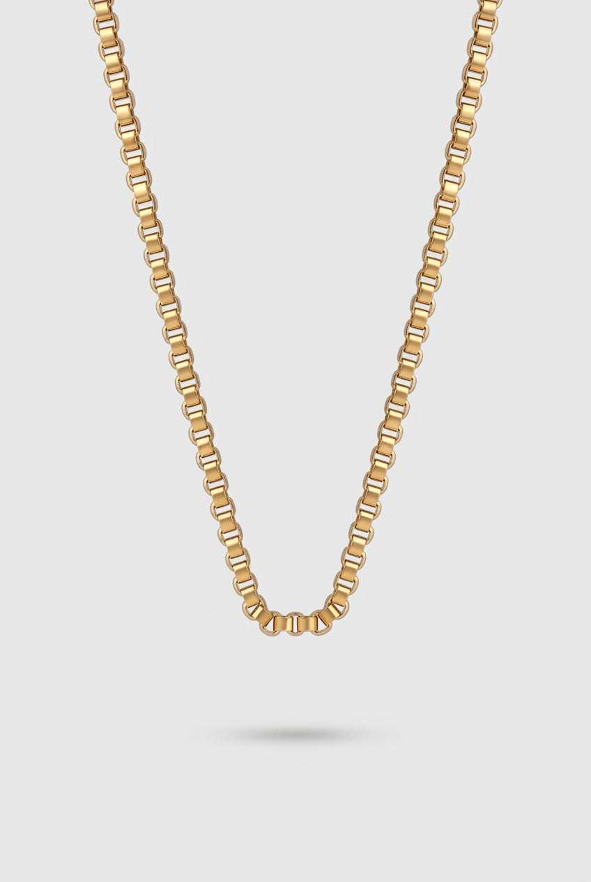 Grid Chain Necklace in gold on a light gray background