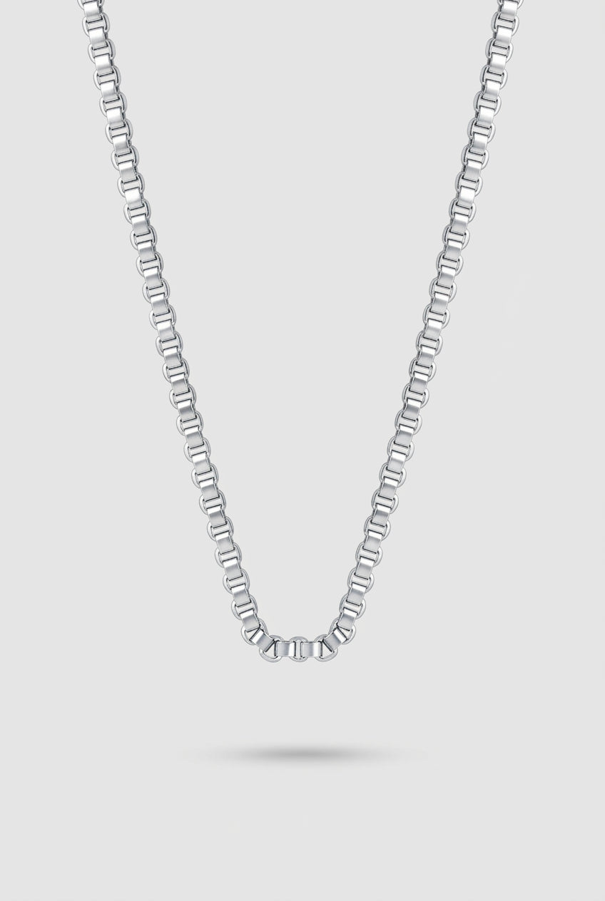 Grid Chain Necklace in silver on a light gray background