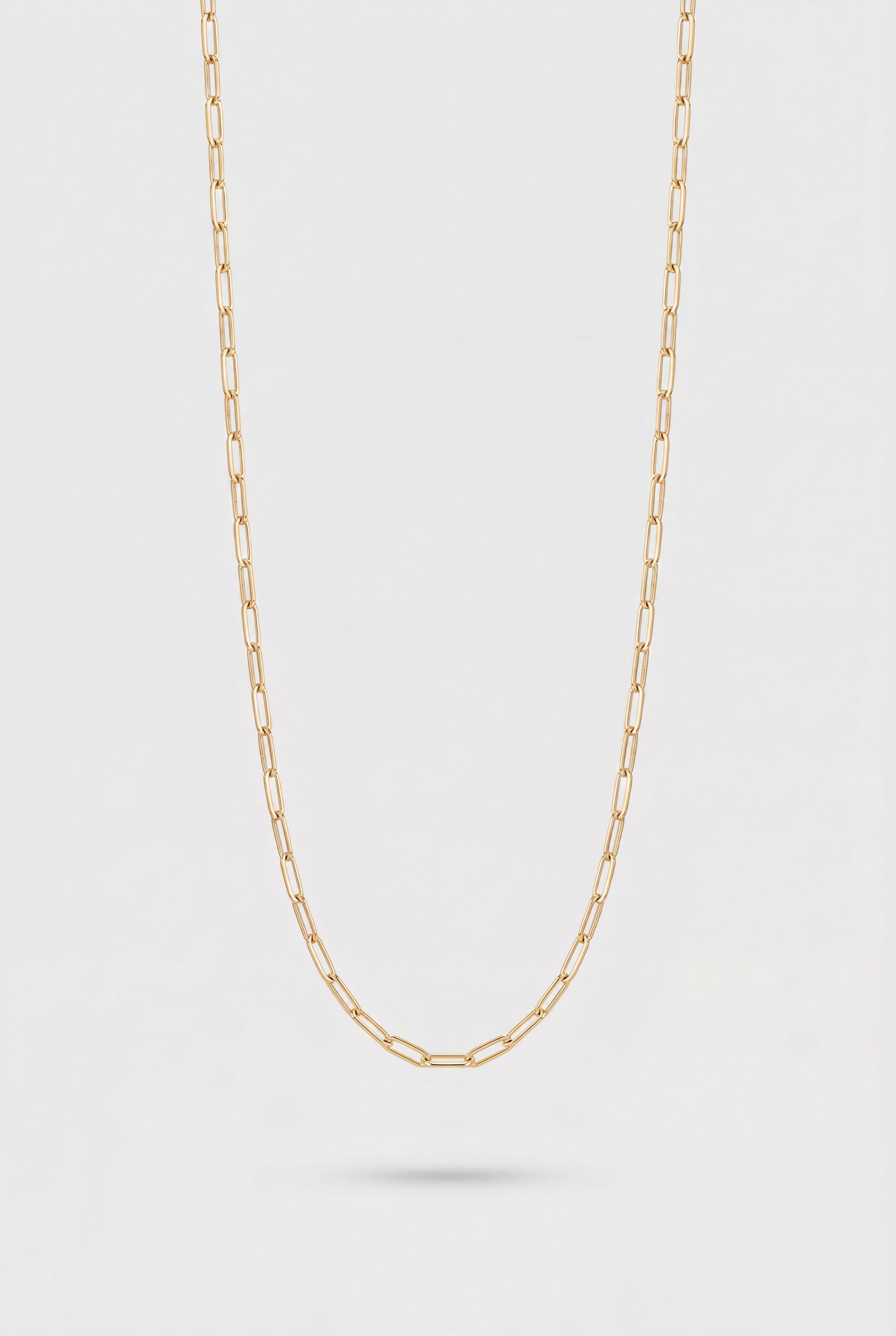 Link Chain Necklace in Gold on a light gray background