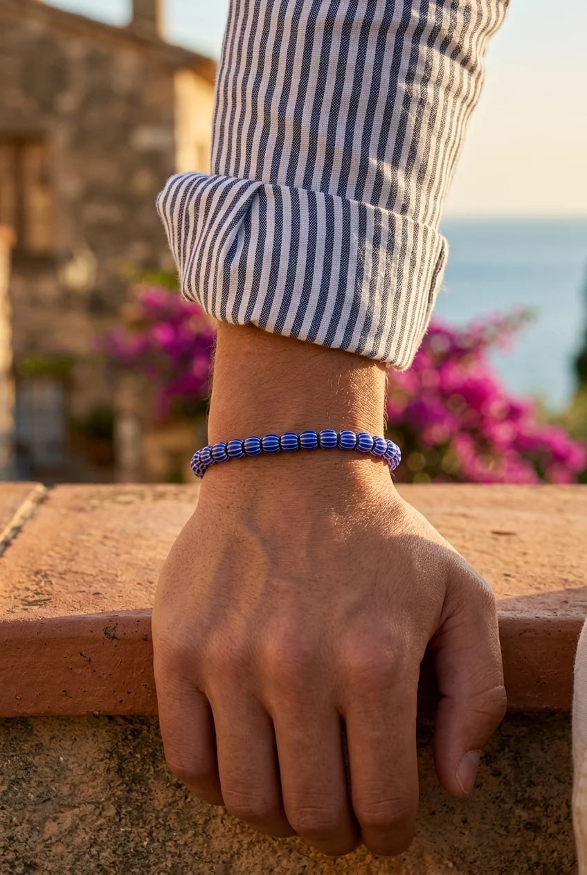 Glass beaded bracelet on a male arm