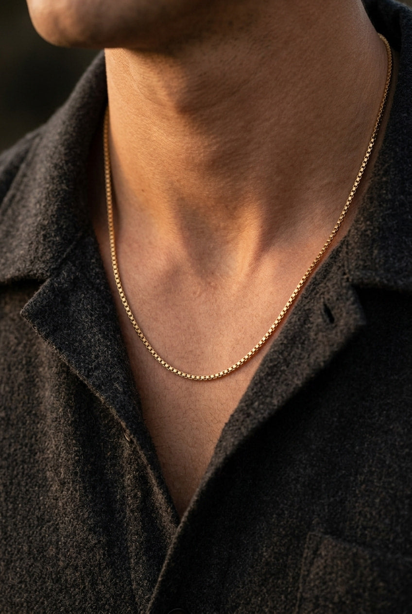 Person wearing a golden necklace
