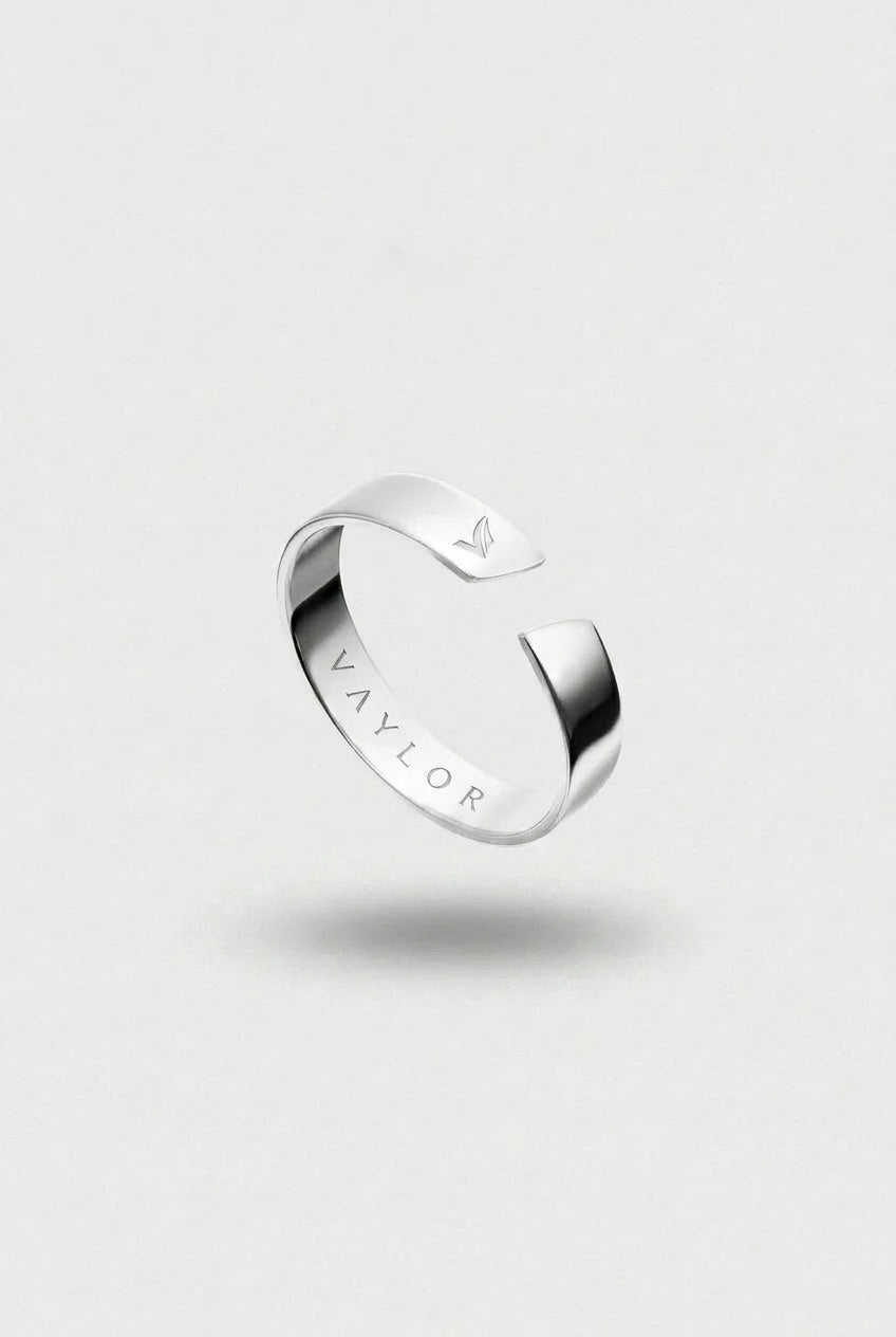 Silver ring on a light gray background