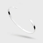 Silver Bangle on a light gray background