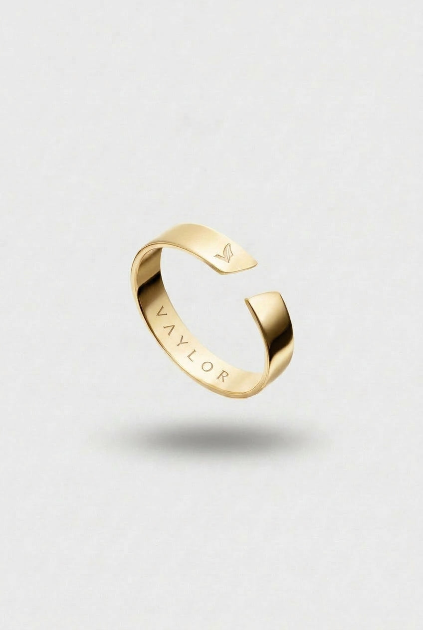 Gold Ring on a light gray background
