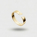 Gold Ring on a light gray background