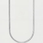 Silver chain necklace on a light gray background