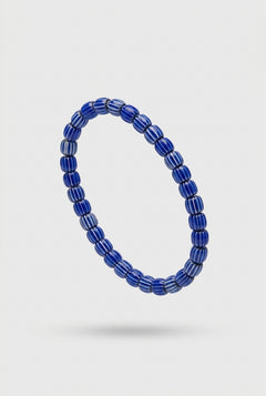 Blue beaded bracelet on a white background