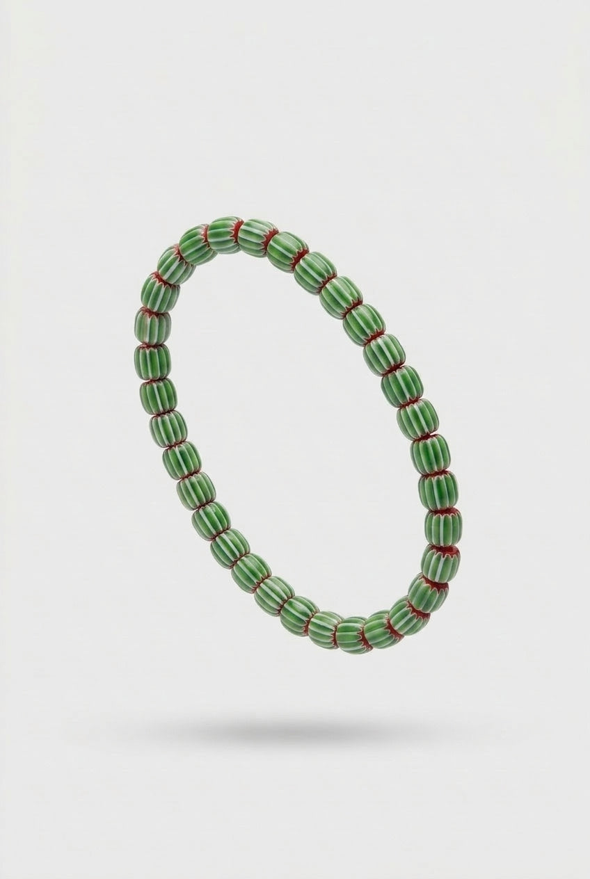 Green beaded bracelet on a white background