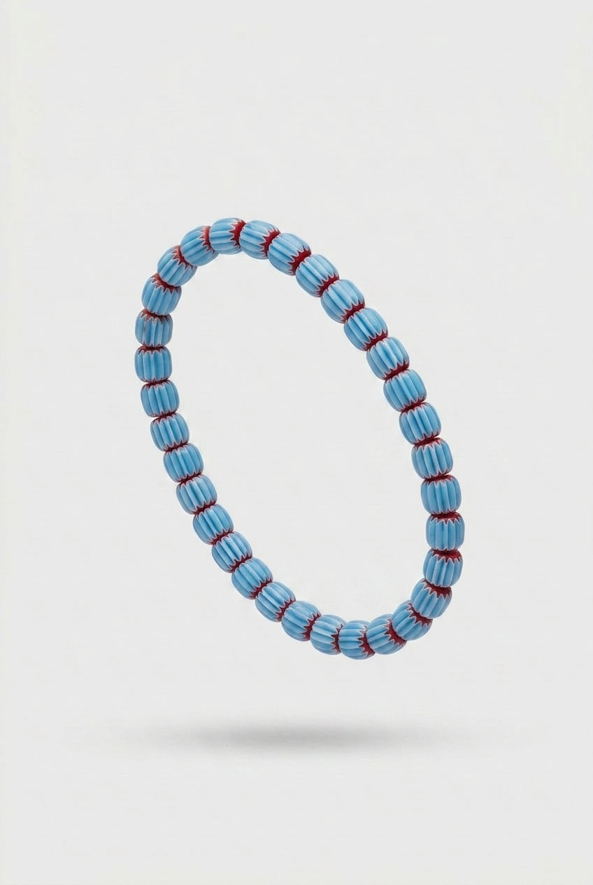Blue beaded bracelet on a white background
