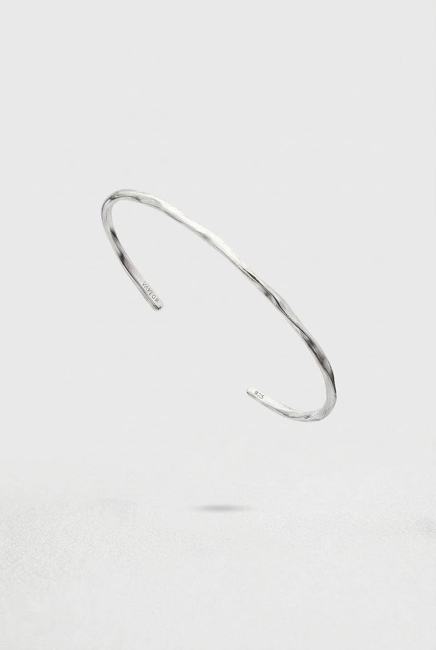 Silver Cuff Bracelet on a light gray background