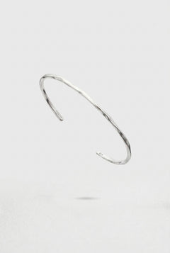Silver Cuff Bracelet on a light gray background