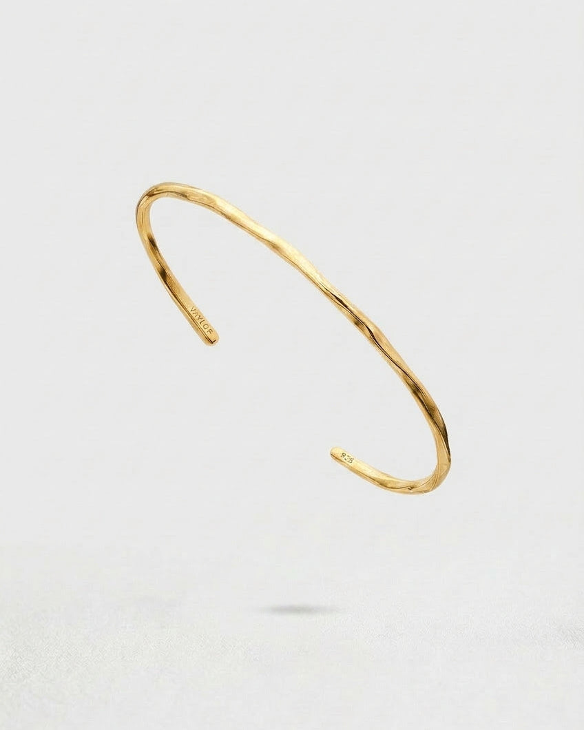 Gold Cuff Bracelet on a white background