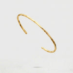 Gold Cuff Bracelet on a white background