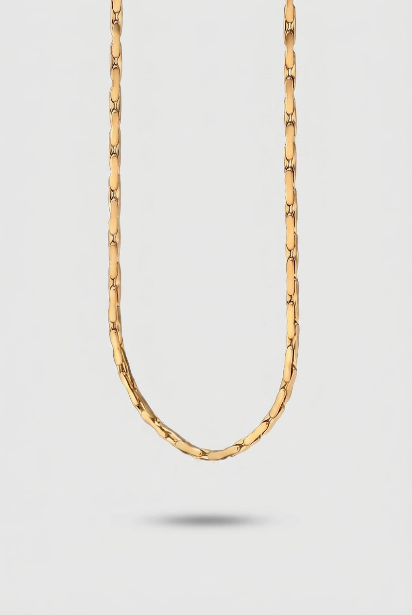 Gold Chain on a light gray background